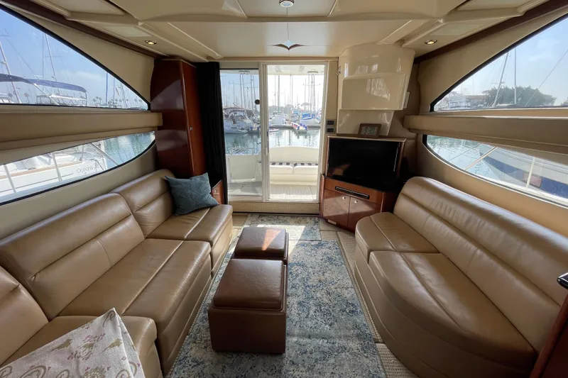 Slide: The Image of Luxurious interior of 2008 Meridian 341 Sedan yacht with leather seating and marina view. - 19