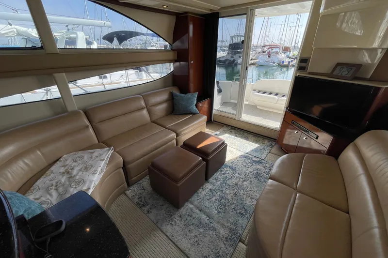Slide: The Image of Luxurious interior of a 2008 Meridian 341 Sedan yacht with leather seating and marina view. - 20