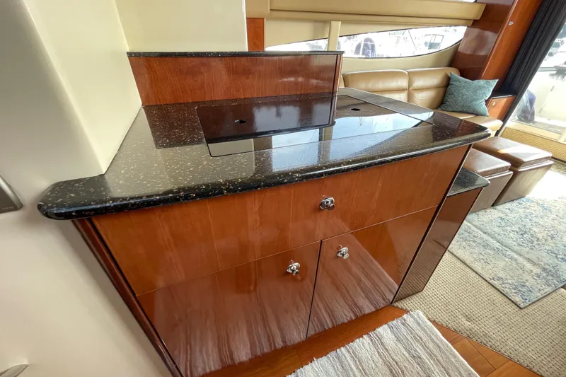 Slide: The Image of Luxurious 2008 Meridian 341 Sedan yacht interior with sleek wood cabinetry and modern design. - 23