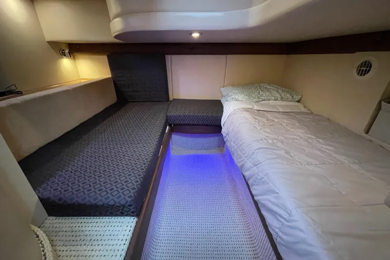Slide: The Image of 2008 Meridian 341 Sedan cabin interior with cozy beds and ambient lighting. - 25