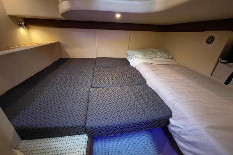 Slide: The Image of 2008 Meridian 341 Sedan cabin interior with cozy bedding and ambient lighting. - 26