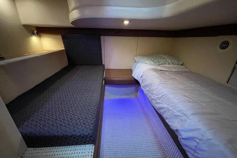 Slide: The Image of Interior cabin of 2008 Meridian 341 Sedan with cozy beds and ambient lighting. - 27