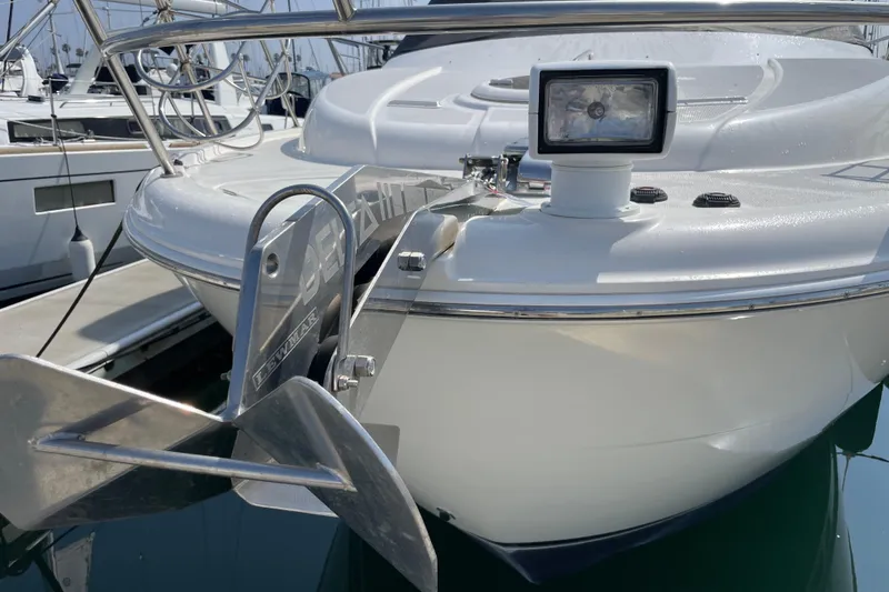 Slide: The Image of 2008 Meridian 341 Sedan yacht bow with anchor and spotlight in marina. - 3