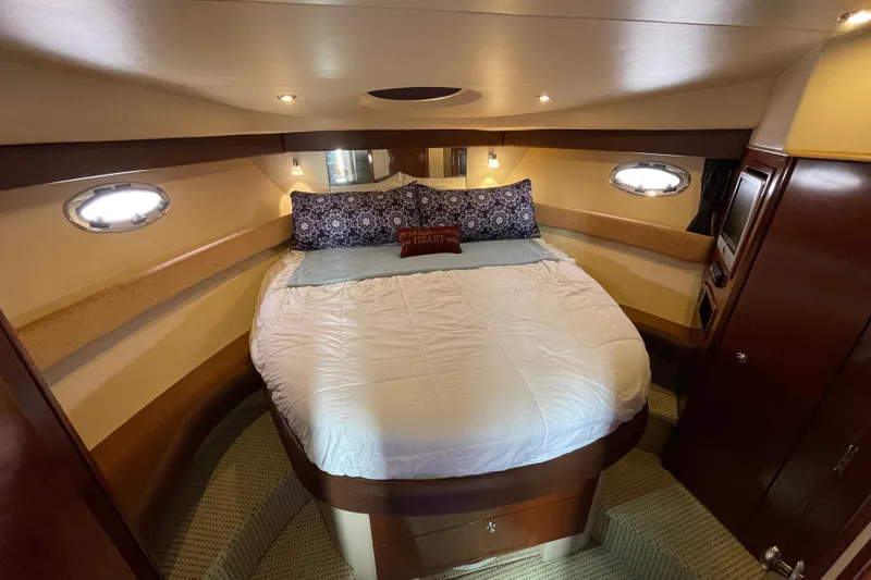 Slide: The Image of Luxurious bedroom interior of 2008 Meridian 341 Sedan yacht with cozy bedding. - 31