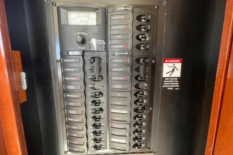 Slide: The Image of Electrical panel on a 2008 Meridian 341 Sedan boat with various circuit breakers. - 35