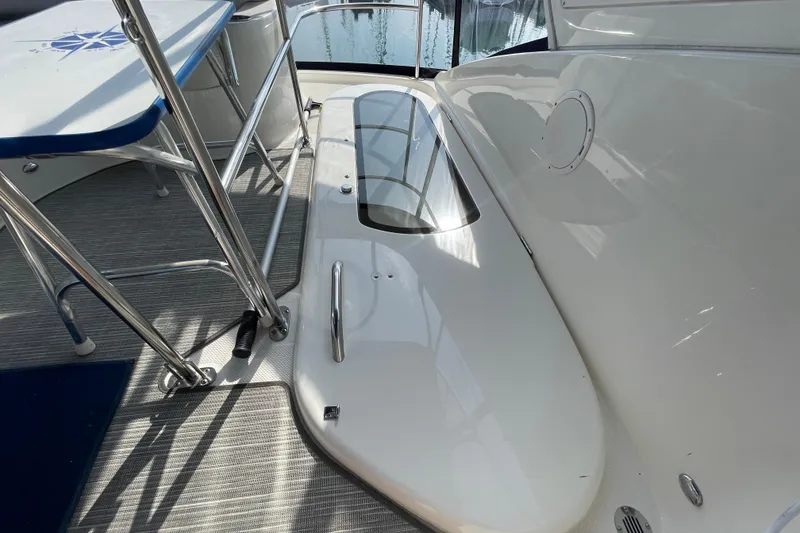 Slide: The Image of 2008 Meridian 341 Sedan yacht deck with stainless steel railings and seating area. - 39