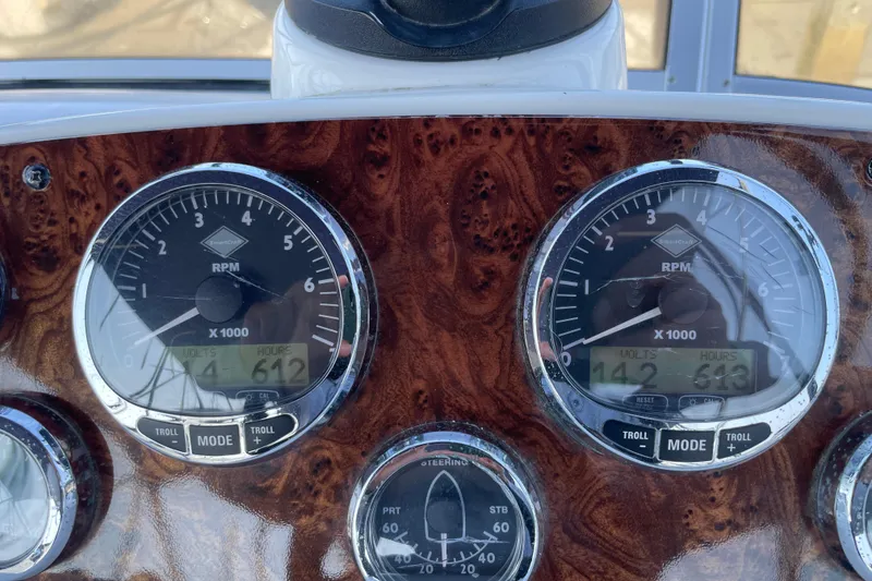 Slide: The Image of Dashboard of 2008 Meridian 341 Sedan with RPM gauges and wood finish. - 43
