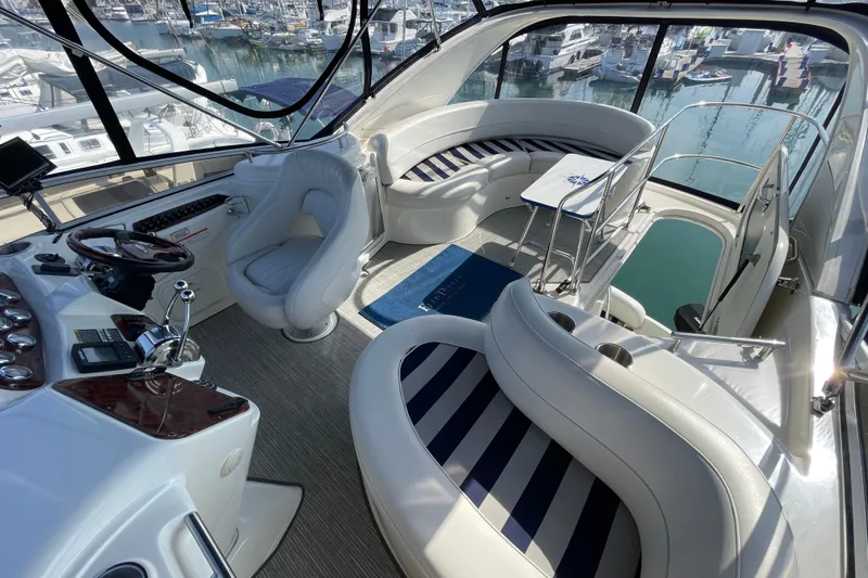 Slide: The Image of 2008 Meridian 341 Sedan yacht interior with luxurious seating and helm, docked at marina. - 48
