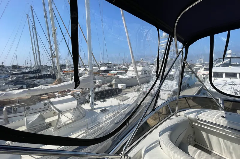 Slide: The Image of 2008 Meridian 341 Sedan yacht view from cockpit, overlooking marina with multiple boats. - 51