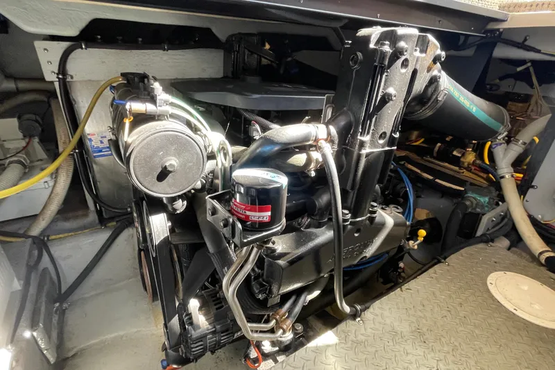 Slide: The Image of Engine compartment of a 2008 Meridian 341 Sedan boat, showcasing mechanical components. - 54