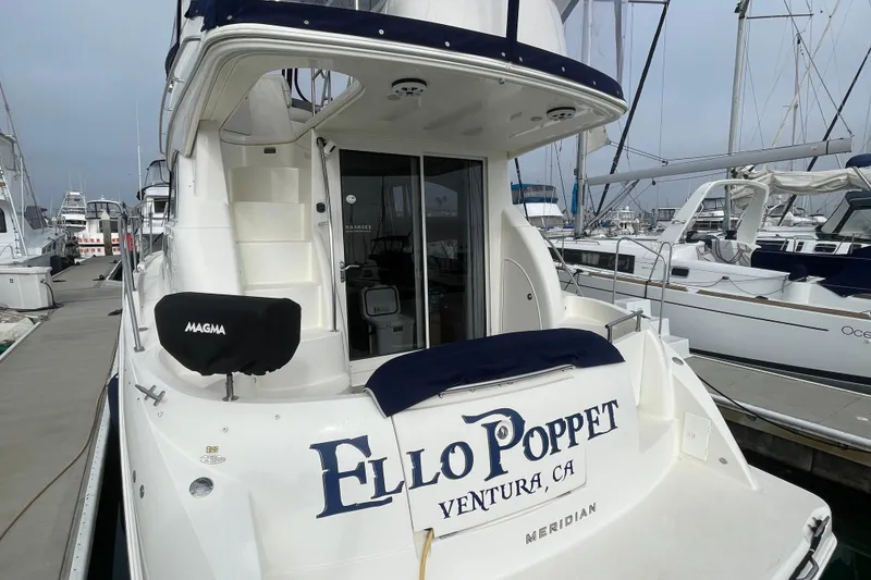 Slide: The Image of 2008 Meridian 341 Sedan yacht docked, featuring "Ello Poppet" name and Ventura, CA location. - 8