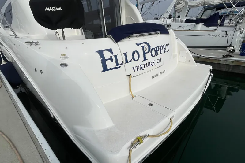 Slide: The Image of 2008 Meridian 341 Sedan docked, displaying "Ello Poppet" and "Ventura, CA" on the stern. - 9