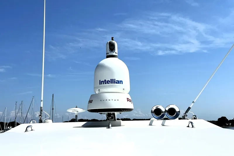 Slide: The Image of 2016 Prestige 550 yacht with spacious sunbathing deck, docked at marina under clear blue sky. - 23