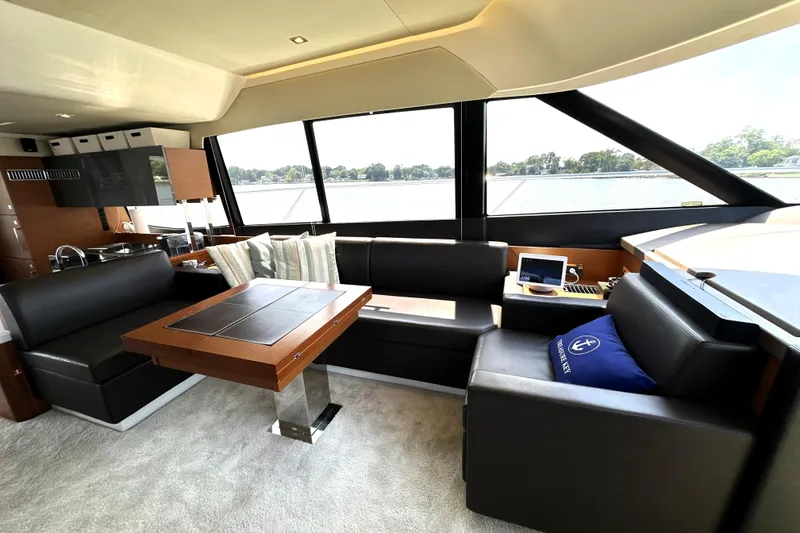 Slide: The Image of Luxury 2016 Prestige 550 yacht with spacious deck overlooking scenic waterfront cityscape. - 32