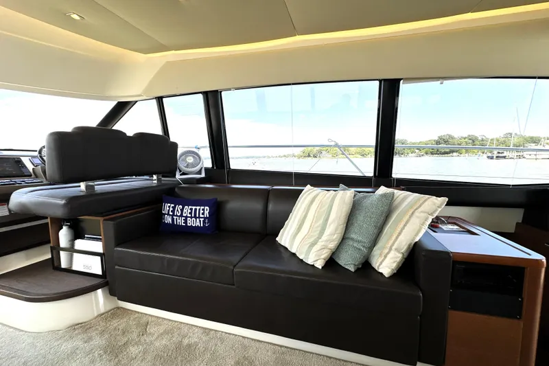 Slide: The Image of 2016 Prestige 550 yacht deck with ocean view and sunny sky. - 34