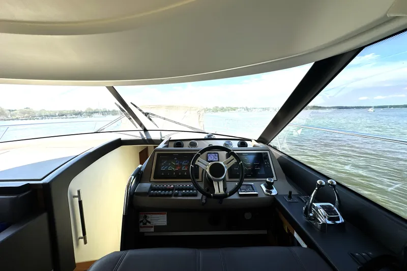 Slide: The Image of Luxurious kitchen interior of 2016 Prestige 550 yacht with modern fixtures and panoramic windows. - 39