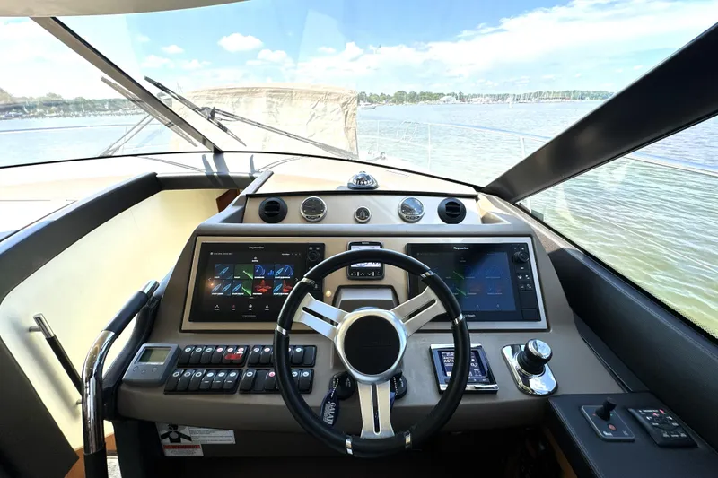 Slide: The Image of Modern kitchen interior on a 2016 Prestige 550 yacht, featuring sleek countertops and appliances. - 40