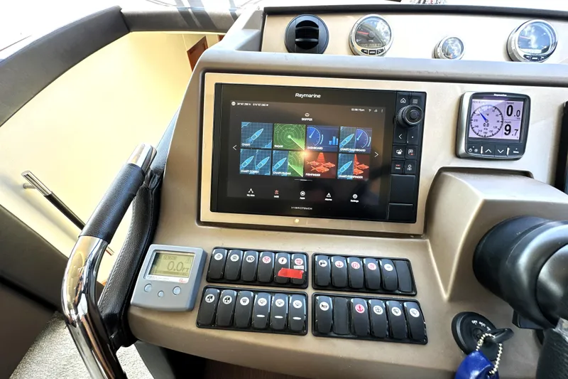 Slide: The Image of Luxurious interior of a 2016 Prestige 550 yacht with panoramic windows and elegant seating. - 41