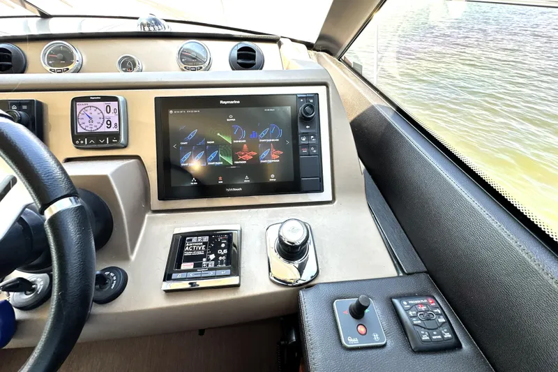 Slide: The Image of Luxurious interior of 2016 Prestige 550 yacht with panoramic windows and elegant seating. - 42