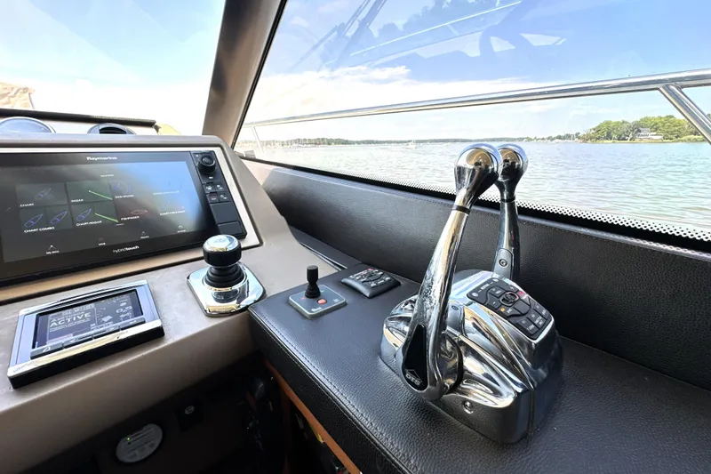 Slide: The Image of Luxurious interior of 2016 Prestige 550 yacht with leather seating and scenic water view. - 43