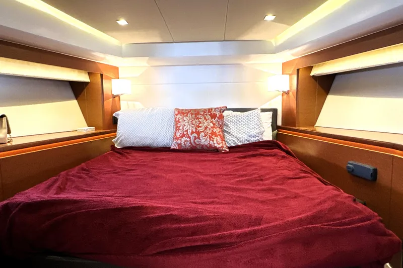 Slide: The Image of Interior view of 2016 Prestige 550 yacht helm with cityscape in background. - 47