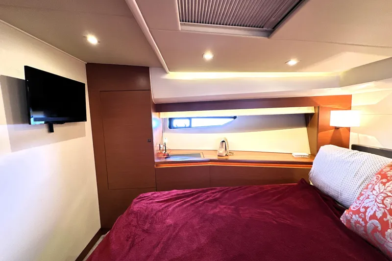 Slide: The Image of Interior view of 2016 Prestige 550 yacht cockpit with leather seating and steering wheel. - 48