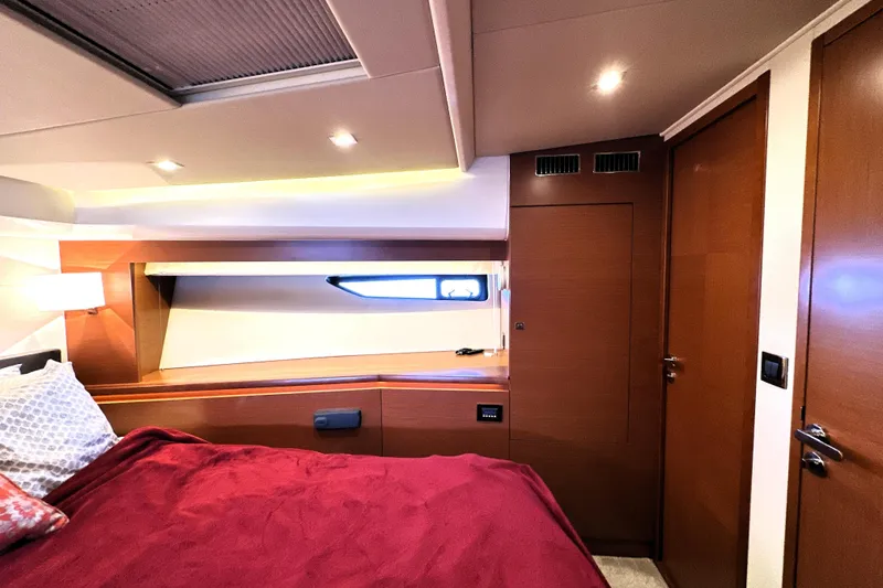 Slide: The Image of Interior view of 2016 Prestige 550 yacht cockpit with cityscape in background. - 49