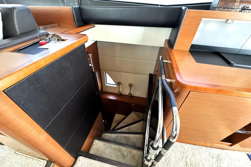 Slide: The Image of Interior staircase of 2016 Prestige 550 yacht, leading to lower cabin area. - 54