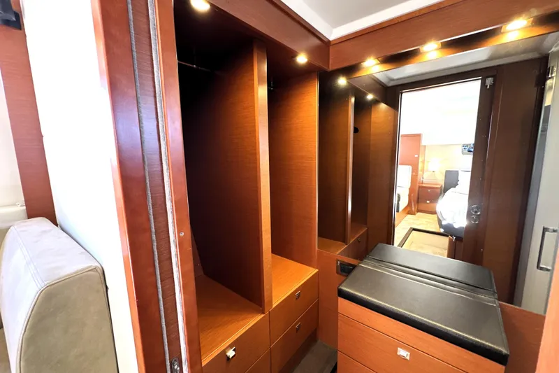 Slide: The Image of Luxurious interior of 2016 Prestige 550 yacht with wooden cabinetry and modern lighting. - 69