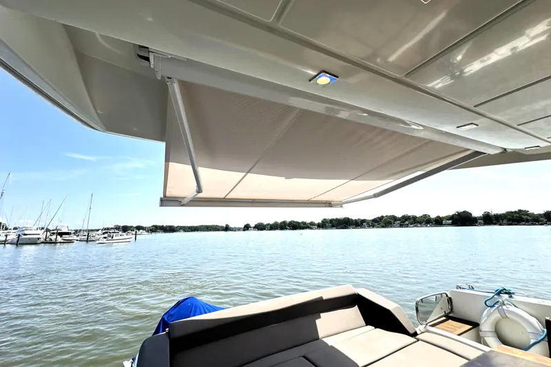 Slide: The Image of Luxury 2016 Prestige 550 yacht on water, clear sky background. - 7