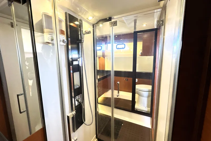 Slide: The Image of Luxurious bathroom in 2016 Prestige 550 yacht with modern shower and toilet. - 70