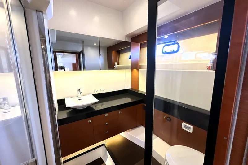 Slide: The Image of Luxurious bathroom interior of 2016 Prestige 550 yacht, featuring modern fixtures and elegant design. - 71