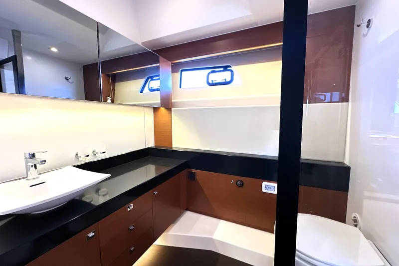 Slide: The Image of Luxurious bathroom interior of 2016 Prestige 550 yacht with modern fixtures and sleek design. - 72