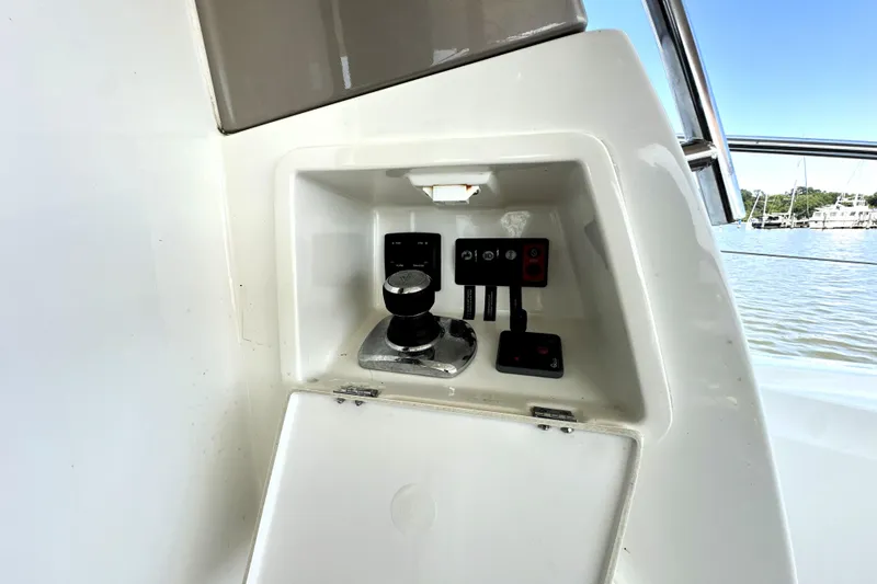 Slide: The Image of Luxury 2016 Prestige 550 yacht on calm water with cityscape background. - 8