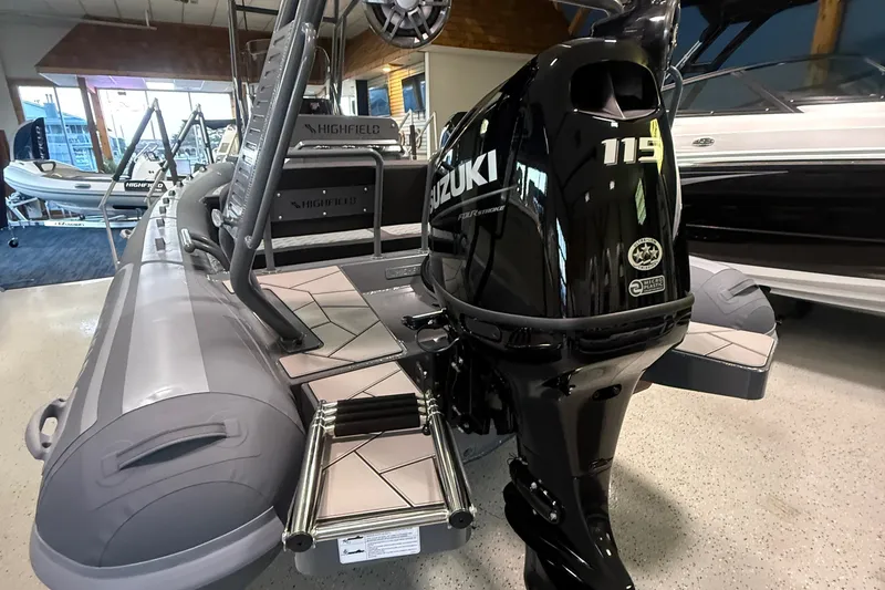 Slide: The Image of 2026 Highfield Sport 560 boat with Suzuki 115 outboard motor in showroom. - 4