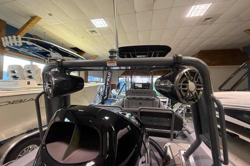 Slide: The Image of 2026 Highfield Sport 560 boat interior with speakers and equipment in showroom. - 5