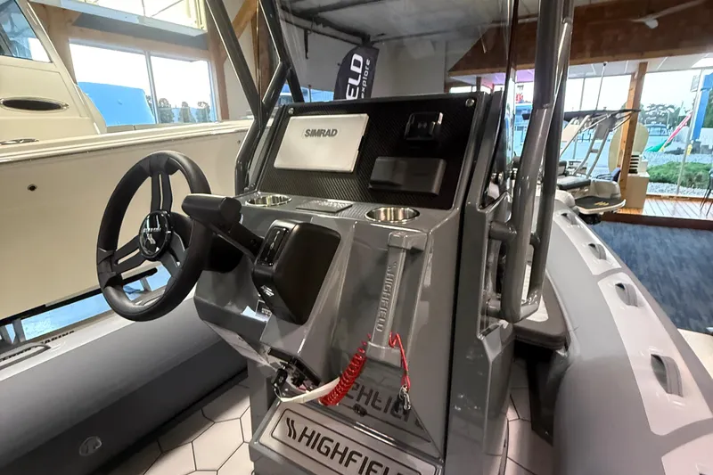 Slide: The Image of 2026 Highfield Sport 560 boat interior with steering wheel and control panel. - 7