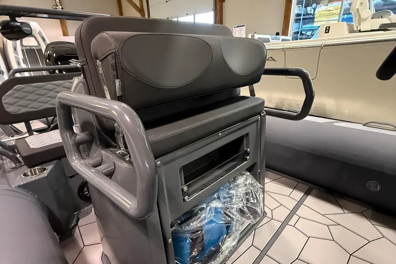 Slide: The Image of 2026 Highfield Sport 560 boat interior with cushioned seating and storage compartment. - 8