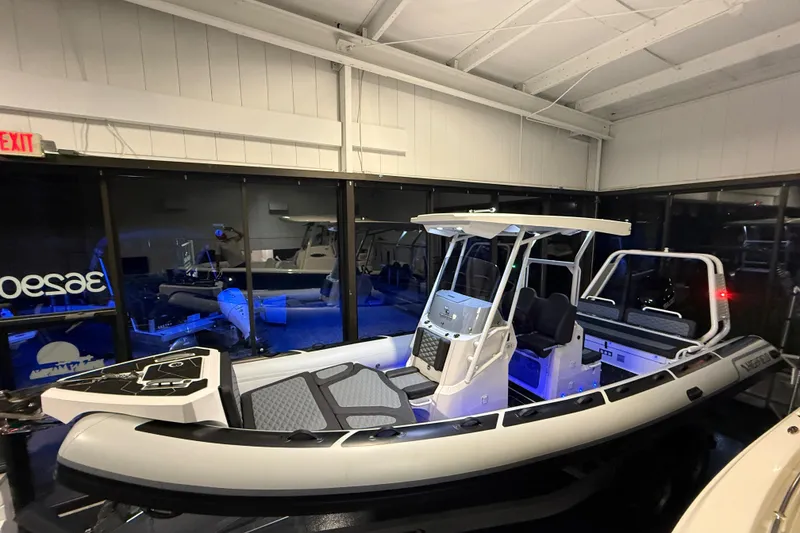 Slide: The Image of 2026 Highfield Sport 760 boat displayed indoors with modern design and seating. - 10