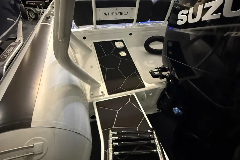 Slide: The Image of 2026 Highfield Sport 760 boat interior with Suzuki engine and modern design elements. - 12