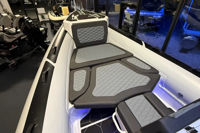 Slide: The Image of 2026 Highfield Sport 760 boat interior with cushioned seating and modern design. - 3