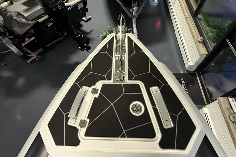 Slide: The Image of 2026 Highfield Sport 760 boat deck with sleek black and white design. - 4