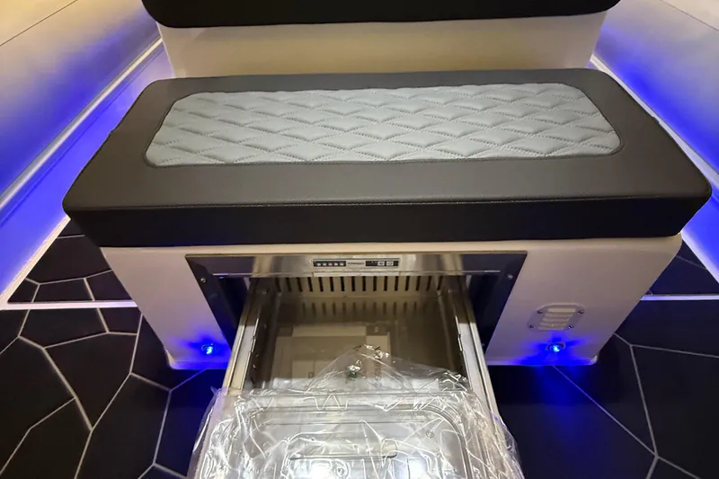 Slide: The Image of 2026 Highfield Sport 760 interior with cushioned seating and built-in storage compartment. - 8