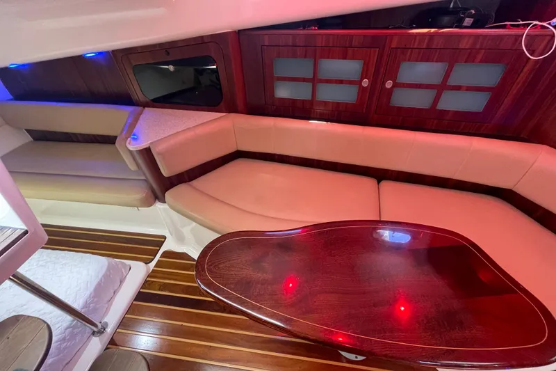 Slide: The Image of Luxurious interior of 2010 Pursuit OS 375 Offshore with elegant wood and leather seating. - 29