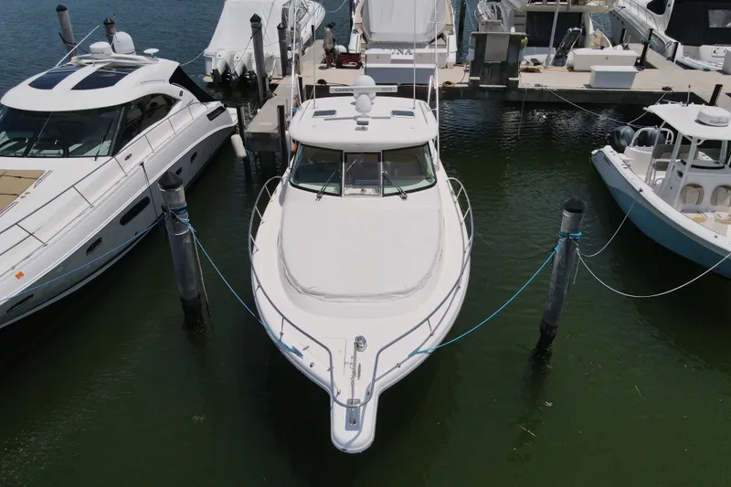 Slide: The Image of 2010 Pursuit OS 375 Offshore boat docked at marina, aerial view. - 4