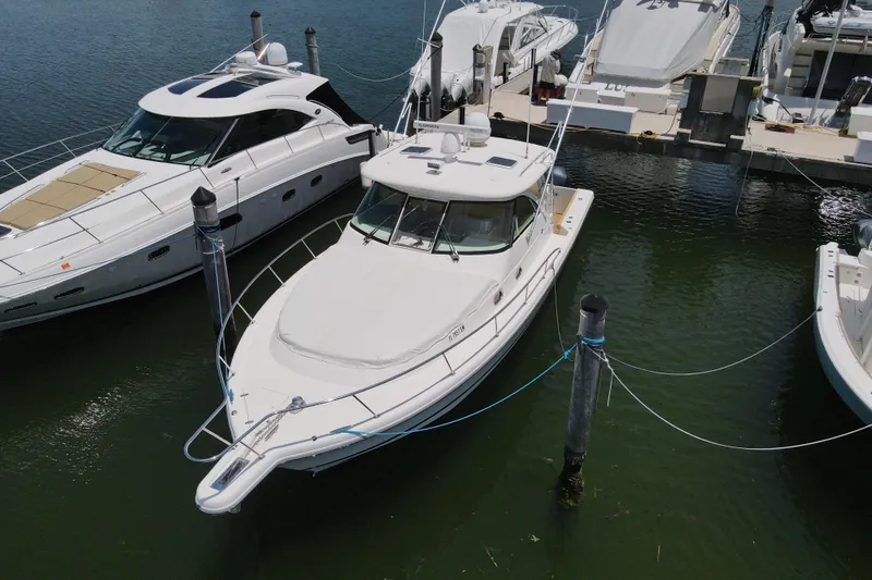 Slide: The Image of 2010 Pursuit OS 375 Offshore boat docked at marina, aerial view. - 5