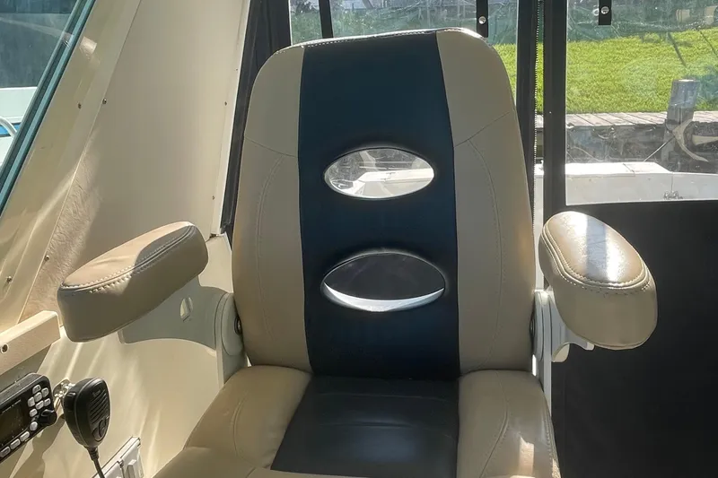 Slide: The Image of Captain's chair in 1999 Albin 28 Tournament Express boat cockpit. - 8