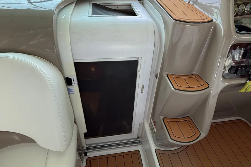 Slide: The Image of 2004 Four Winns 298 Vista boat interior with seating and control panel. - 22