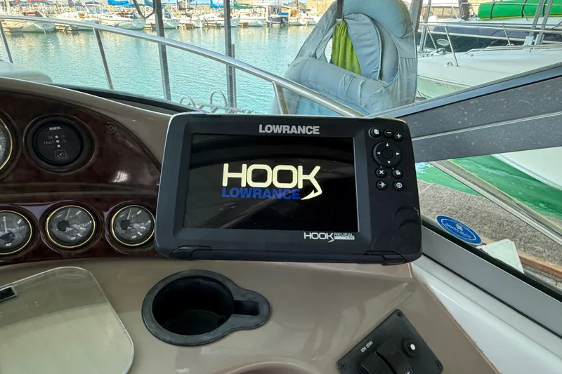 Slide: The Image of Control panel of a 2004 Four Winns 298 Vista boat with Lowrance Hook Reveal GPS. - 23