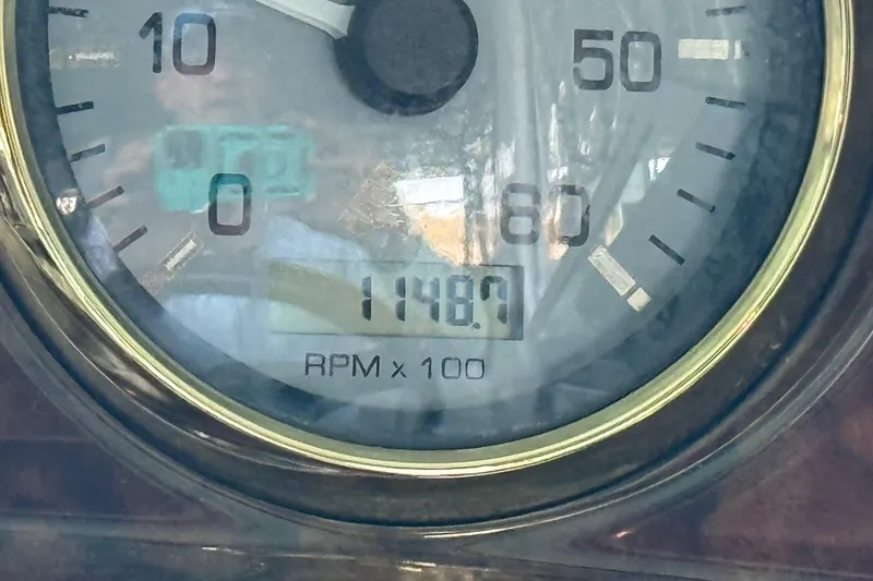 Slide: The Image of Close-up of a 2004 Four Winns 298 Vista tachometer showing 1148.7 RPM. - 24